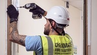 Checkmate Fire accredited fire door fitter carrying out fire door installation