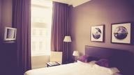 Bedroom with light streaming in.