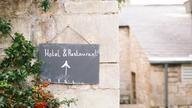 Sign for a hotel and a restaurant.