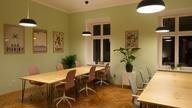 Room with 2 tables and chairs.
