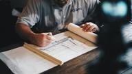 Man drawing plans.