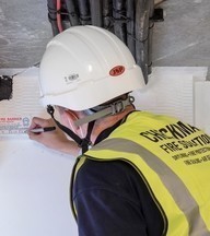 Accredited Checkmate fire consultant carrying out fire compartmentation survey