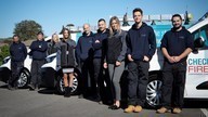 checkmate fire installers outside next to checkmate fire vans