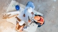 fire engineering consultant and builders in hard hats draw up plans
