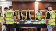 Fire door installers in meeting.