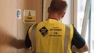 Fire door installer fits door.