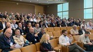 professionals sat listening to a lecture